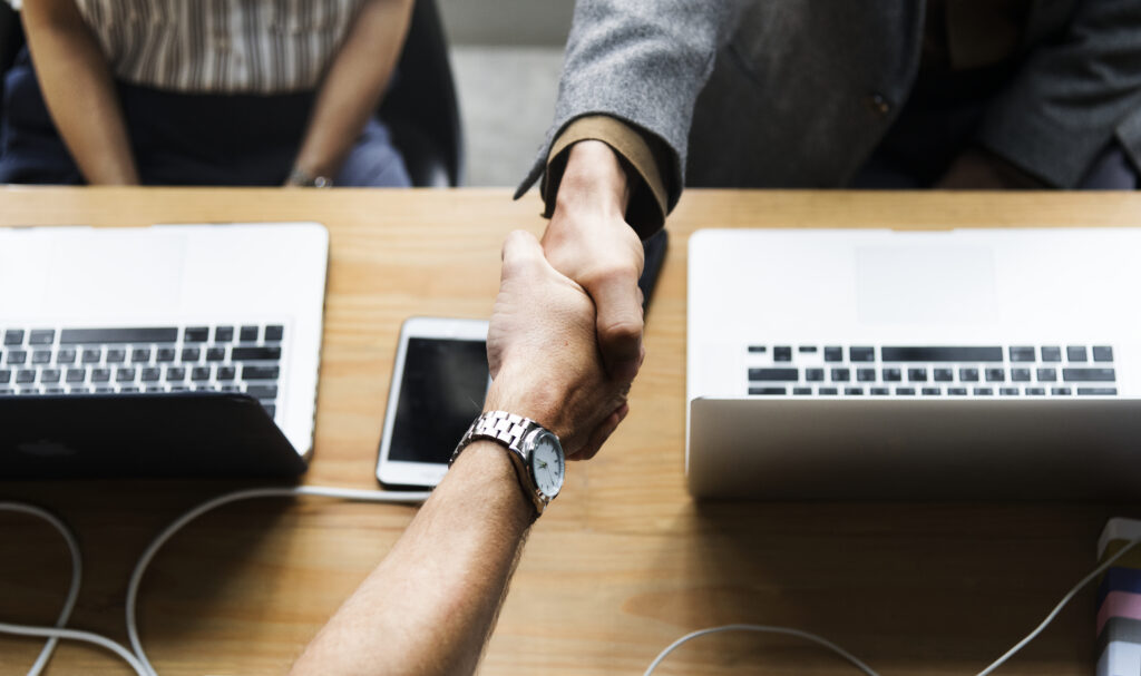 Business people shaking hands in agreement